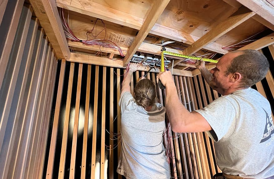 SaunaCloud installers with a finished custom infrared sauna
